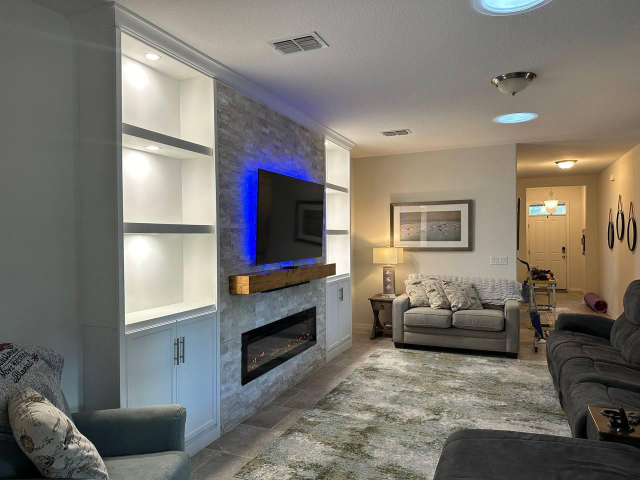 Custom built-in entertainment center with floating shelves in Seattle